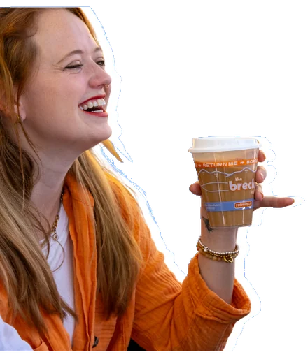A customer laughing with a Colorado Cup